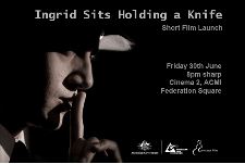 Ingrid Sits Holding a Knife