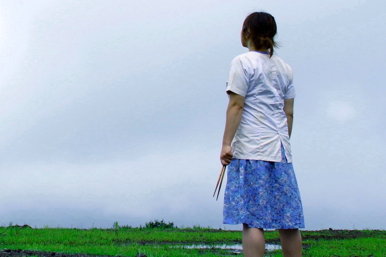 Woman Who Is Beating the Earth