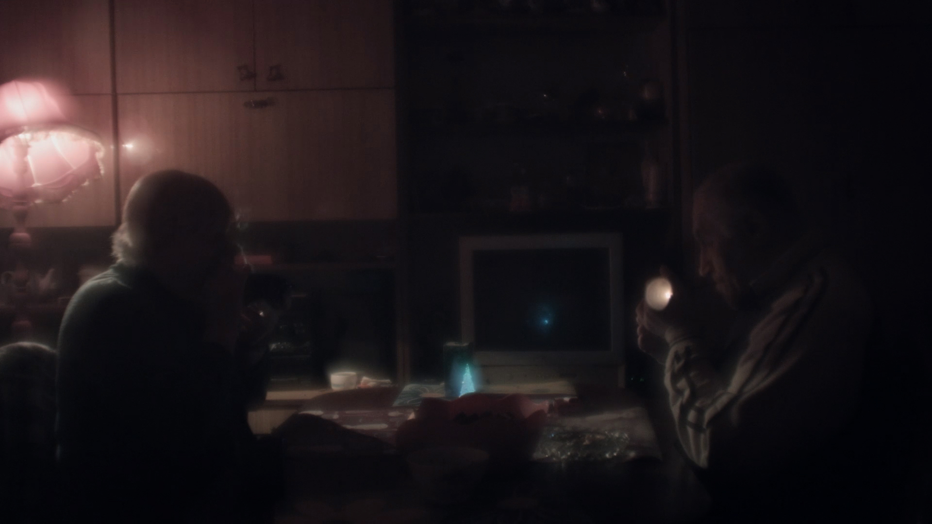 Couple in a room smoking cigarettes